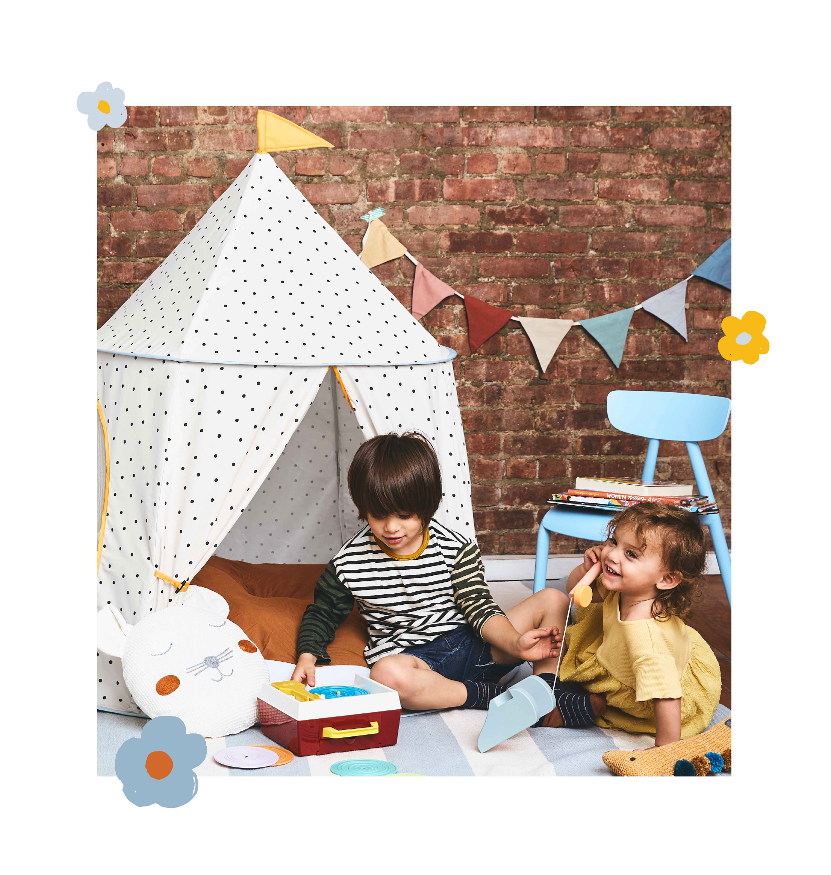 polka dot tent with two kids a little boy and girl playing in front with vintage toys