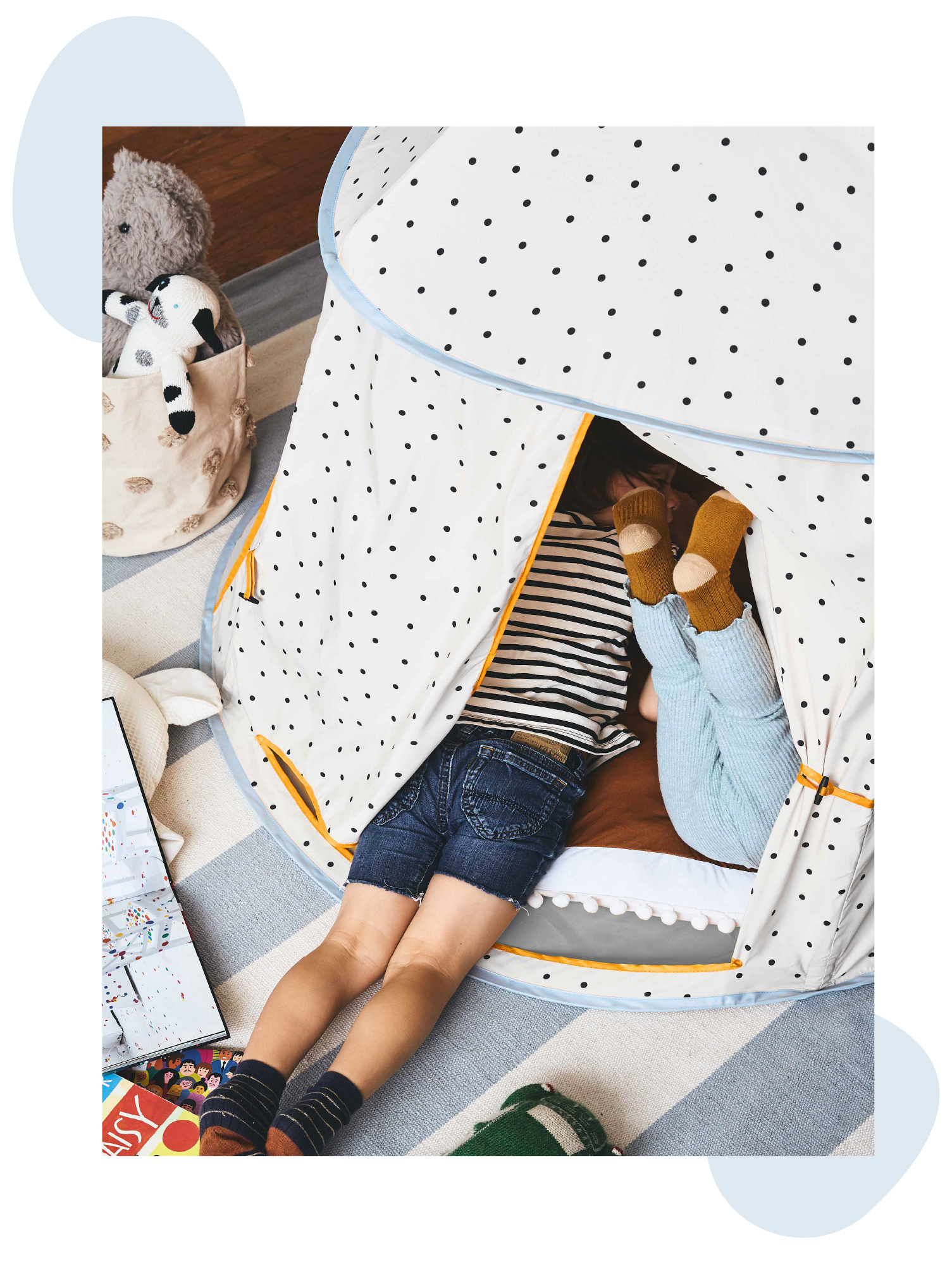 two kids in the polka dot play tent playing